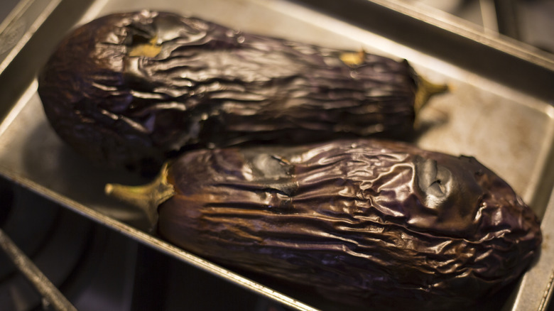 Roasted eggplants on baking tray