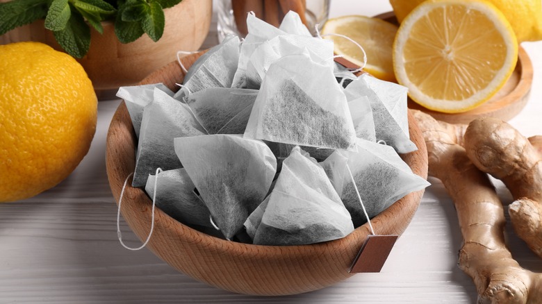 Bowl of tea bags with strings and paper tabs