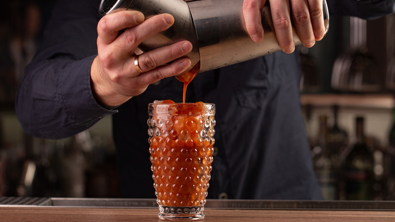 Bartender pouring a Bloody Mary