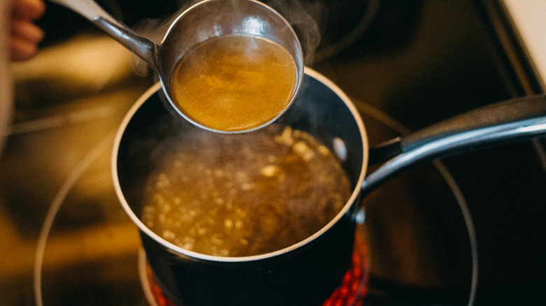 Cooking soup in saucepan