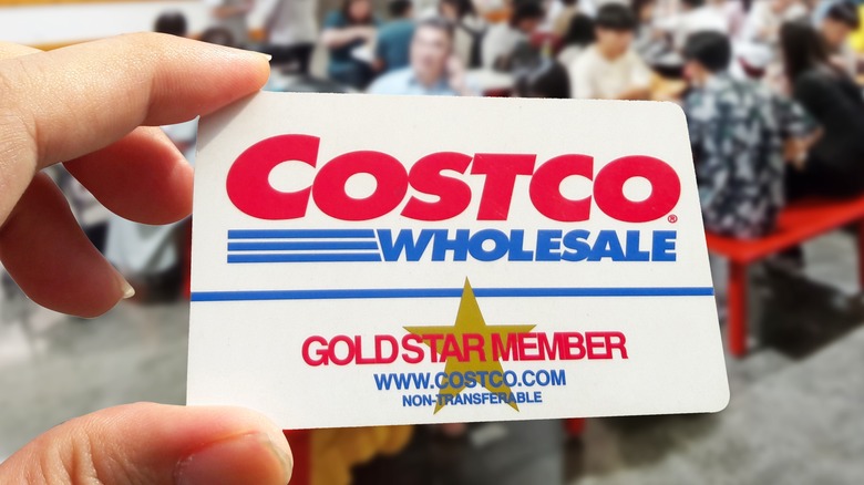 Hand holding Costco card