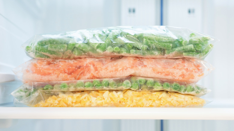 vegetables in freezer bags stacked in the freezer