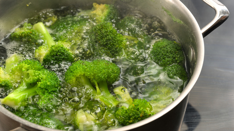 broccoli florets in pot of boiling water