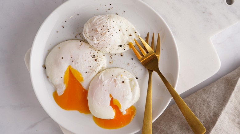 Poached eggs on plate