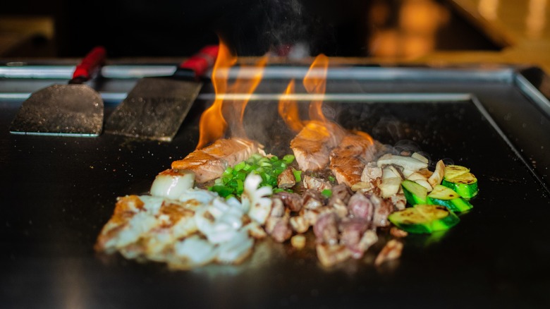 Hibachi steak and veggies on flat top griddle