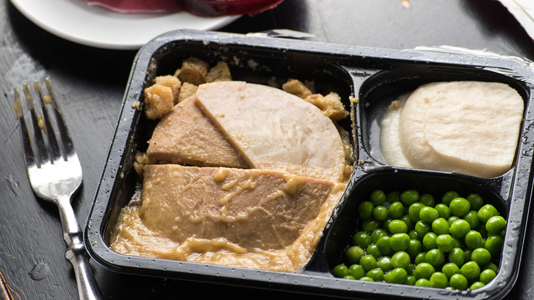 frozen dinner with meat and peas