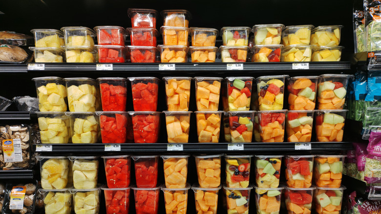 Pre-cut fruit in packages in a grocery store cooler