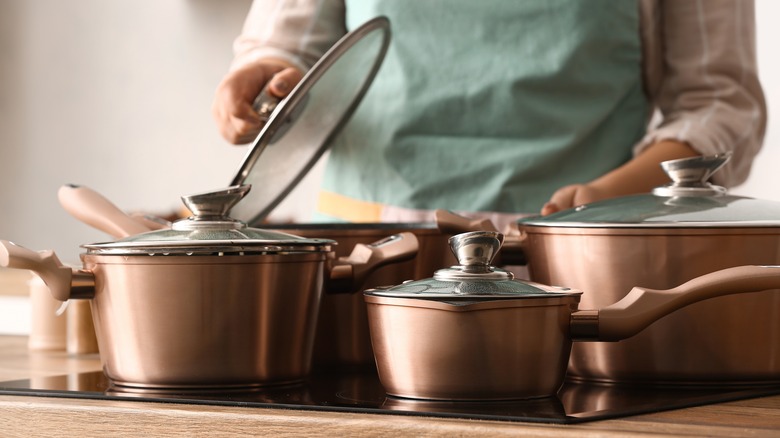 copper pots displayed in kitchen