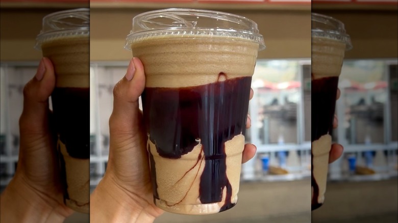 Hand holding a Costco Cold Brew Mocha Freeze