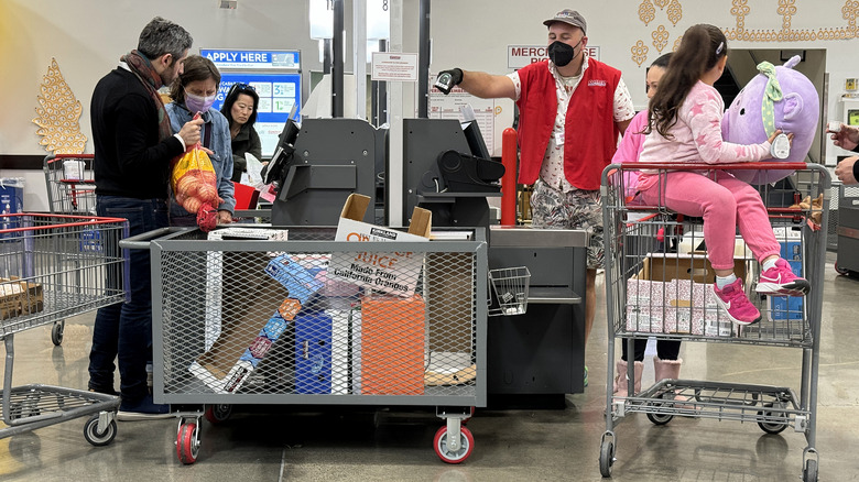 Customers paying at Costco