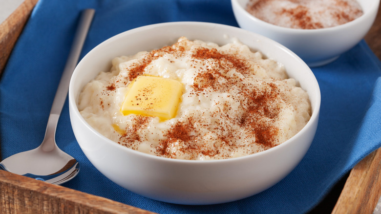 risgrøt Norwegian rice porridge in bowl with cinnamon and butter