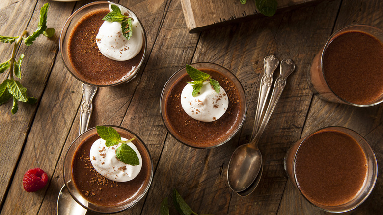 individual cups of chocolate pudding with whipped cream