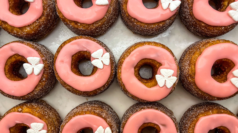 dozen pink-glazed cronuts