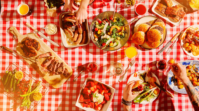 passing foods on picnic blanket