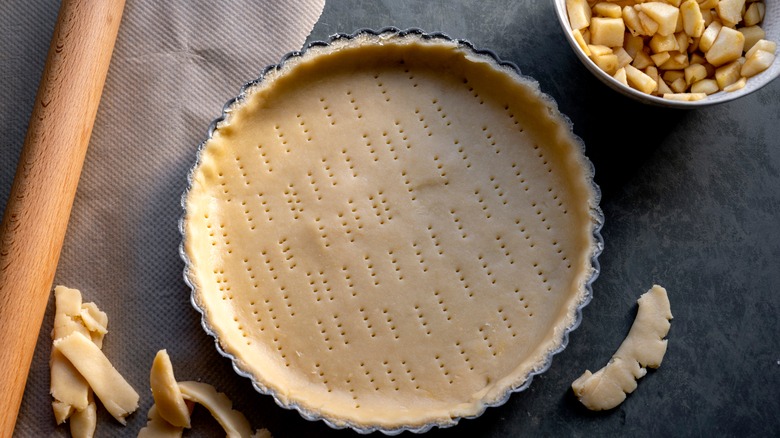 Homemade pie crust with apples in a bowl 