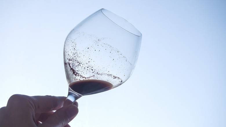 Tannin sediment in wine glass