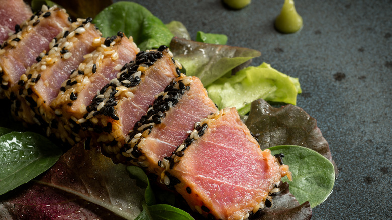 ahi tuna steak on a bed of greens