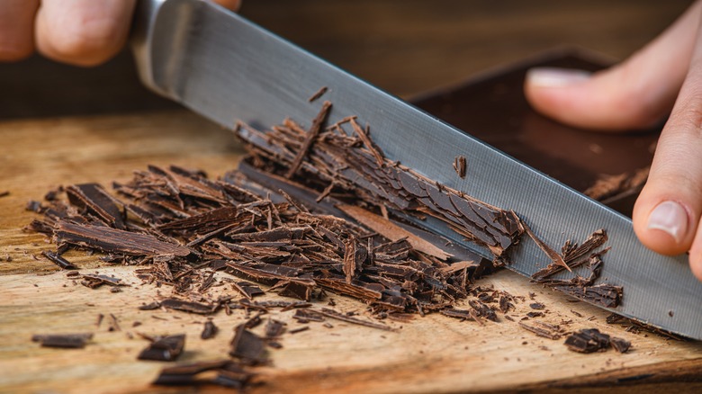 Chef's knife cutting chocolate