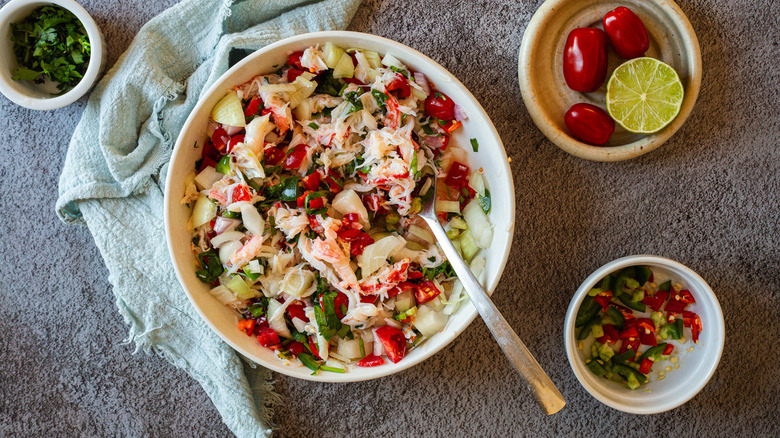 Crab ceviche in bowl with spoon 