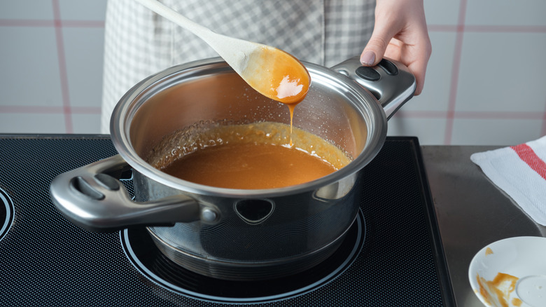 woman stirring caramel