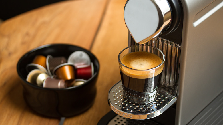 A Nespresso coffee machine in action.