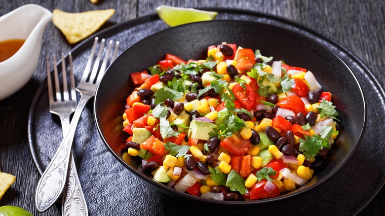 Bean salad in black bowl