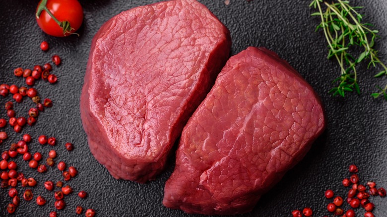 two raw steak cuts of eye rounds