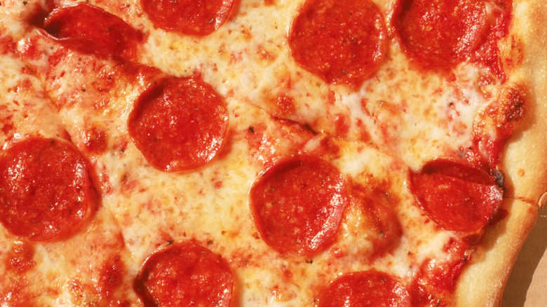 Close-up of greasy pepperoni pizza