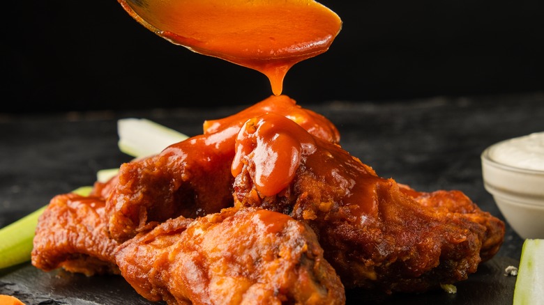 Sauce poured onto chicken wings