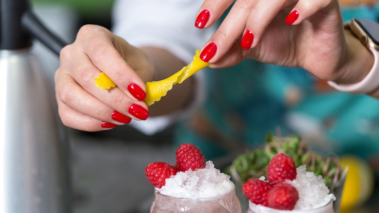 woman garnishing a drink 