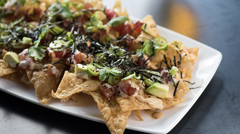Yard House's poke nacho appetizer served on a large white plate