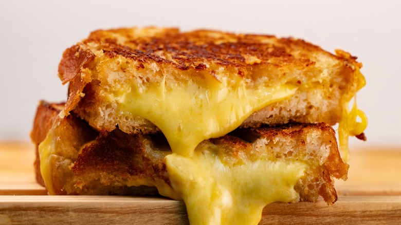 melted cheese pouring oozing sandwich