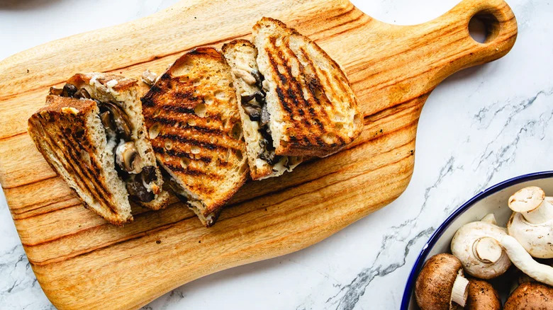 Mushroom grilled cheese on wood board