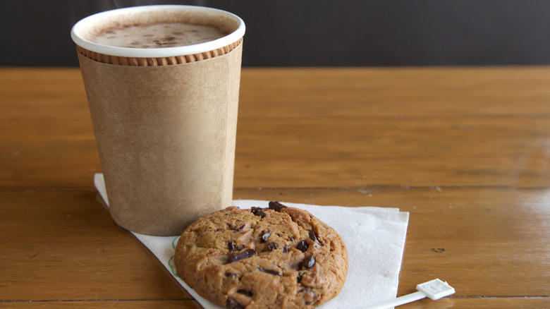 To-go coffee cup, cookie, napkin