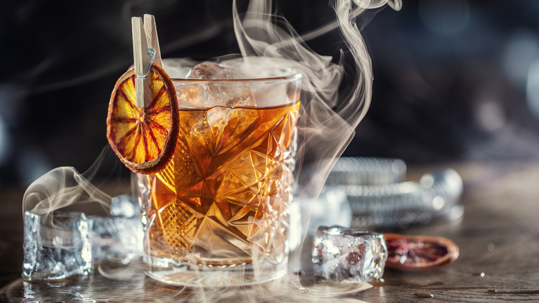 smoky old fashioned in crystal glass