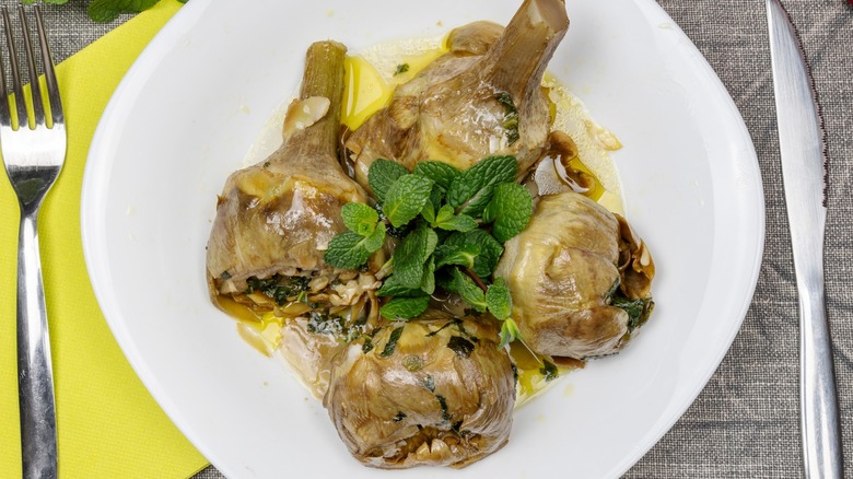 Top-down view of carciofi alla romana on a plate