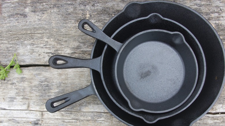 stack of cast iron skillets