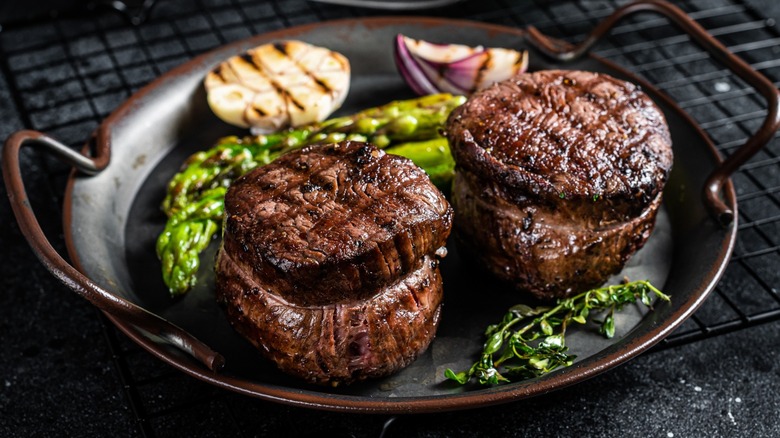 Two filet mignon steaks in a pan