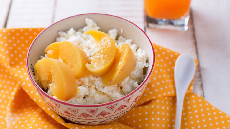 cottage cheese in a bowl with peaches