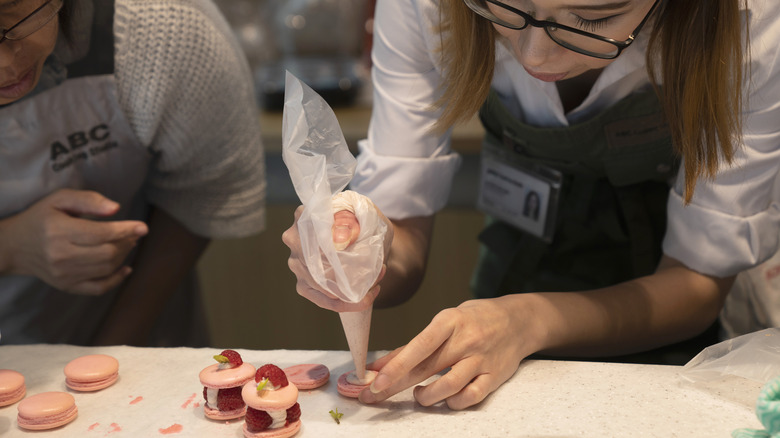 Chef making macaron pastries 