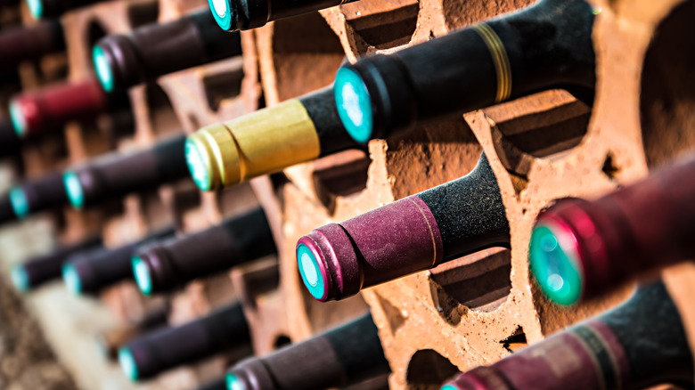 bottles of wine in a brick wine rack