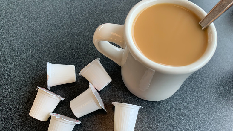 half and half containers beside coffee