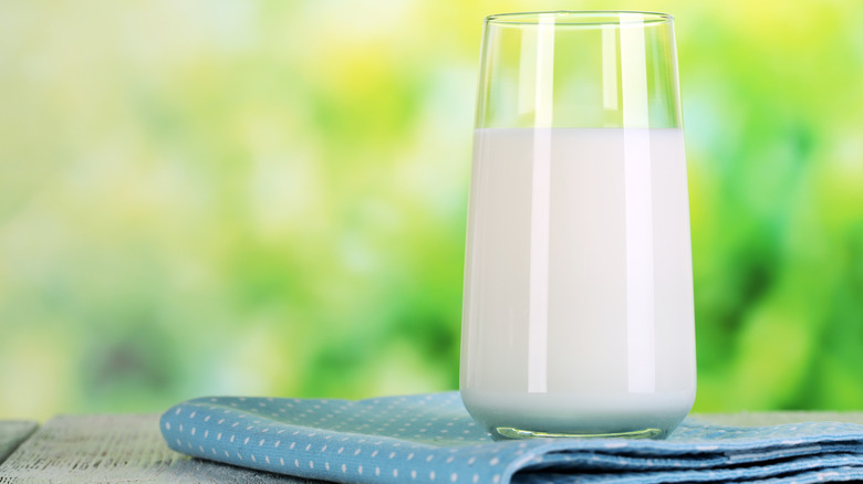 glass of milk on napkin