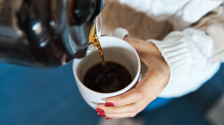 pouring coffee into mug