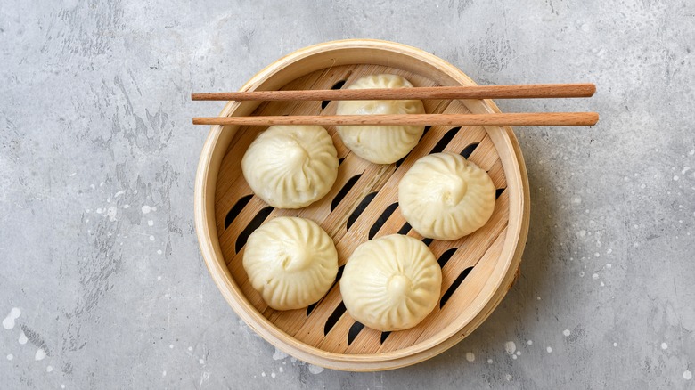 bao dumplings with chopsticks