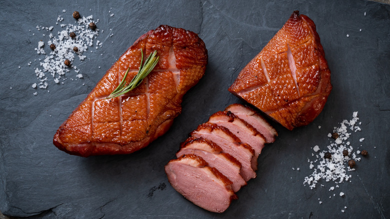 Roasted duck breast on slate cutting board 