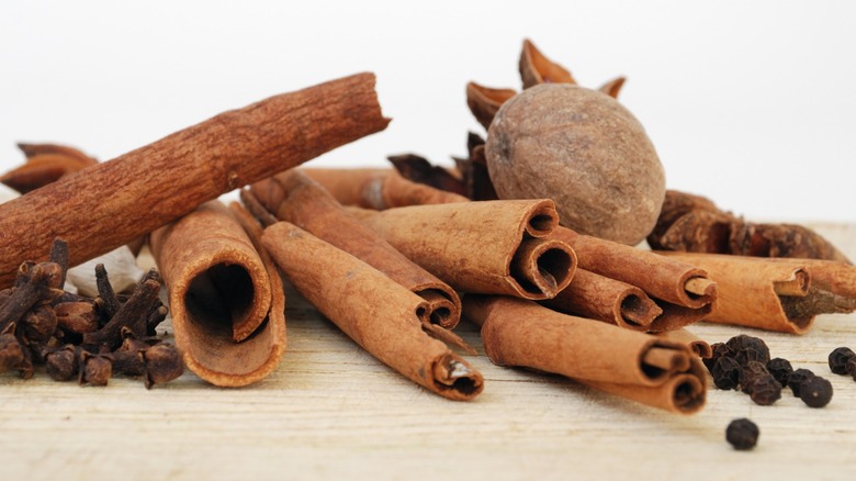 Various dried spices and cinnamon sticks