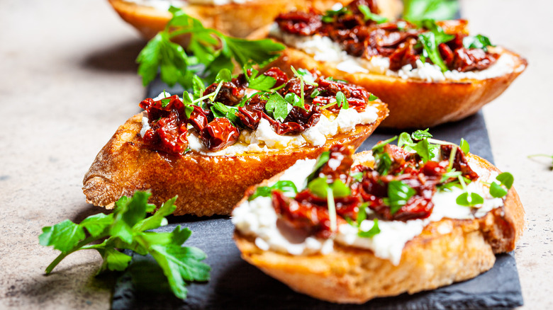 Sun-dried tomatoes on baguette bread