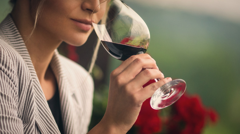 woman smelling wine