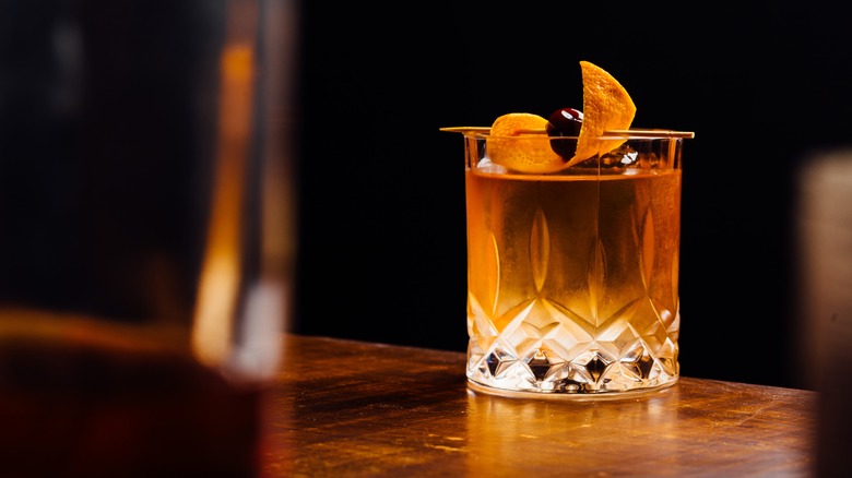 Old fashioned cocktail on a table 